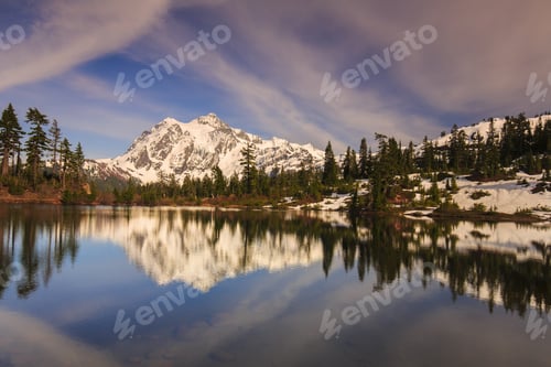 Preview: Stunning Landscape Of Snowy Mountain Reflecting Over The Water