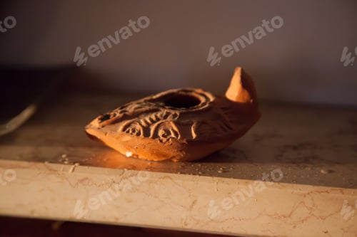 Preview: Old Clay Oil Lamp In The Morning Sunshine