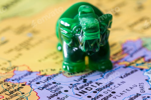 Preview: View Of A World Map With India In Focus Adn A Small Jade Elephant