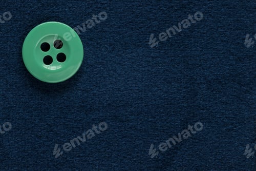 Preview: Clothes Sewing Button On A Blue Fabric Swatch Background