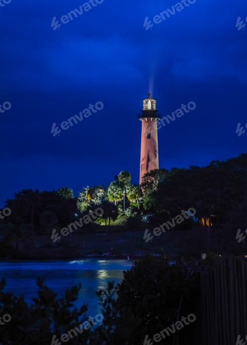 Preview: The Jupiter Lighthouse In The Early Light Of The Morning With Its Light'S Rays In The Sky