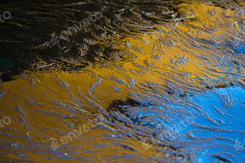 Preview: Reflections In Water With Ripples And Movement. Yellow And Blue.
