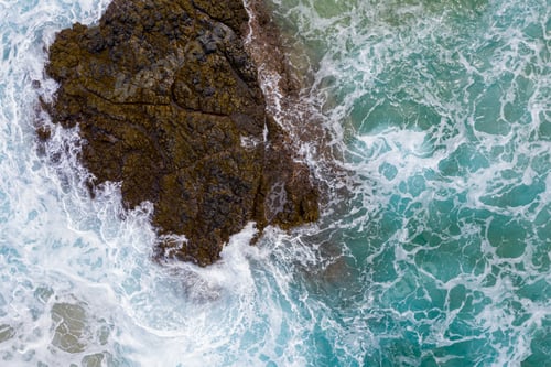 Preview: Drone Aerial View Of Waves Crashing Over Rocks On Lumaha'I Beach On North Shore Of Kauai