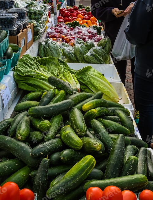 Preview: Colorful Display Of Fruit And Vegetables At A Florida Farmer'S Market As Shoppers Make A Purchase.