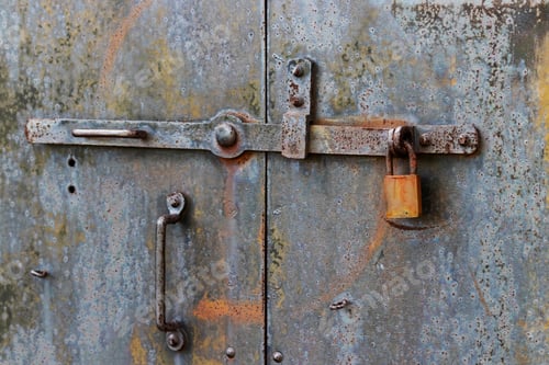 Preview: Old Rusty Latch And Lock On Heavy Metal Door