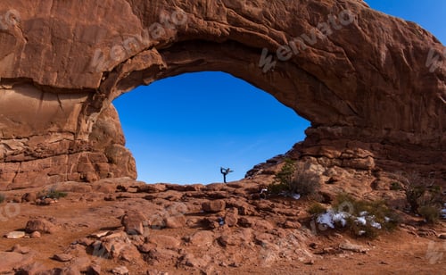 Preview: Woman Doing A Yoga Balancing Pose In North Window With A Deep Blue Sky In The Background
