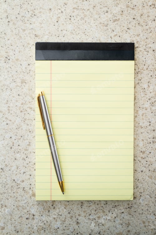 Preview: Close Up Of A Blank Note Pad And A Pen For A Home Office Concept