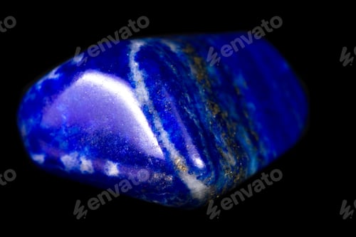 Preview: Close Up Of A Beautiful Blue Piece Of Lapis Lazuli Isolated On A Black Background