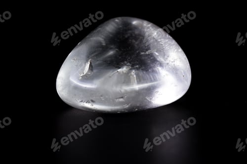 Preview: Close Up Of A Polished Piece Of Clear Quartz Isolated On A Black Background