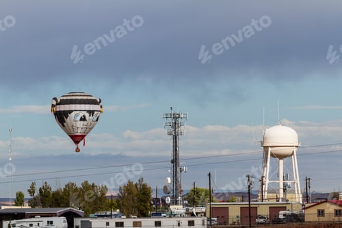 Preview: Page Arizona - October 31 : Hot Air Balloon Getting Close To Power Lines And A Water Tower, October