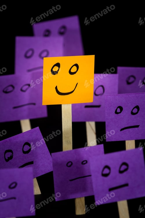 Preview: Conceptual Image Using Sticky Notes With Hand Drawn Faces On Them Isolated On A Black Background