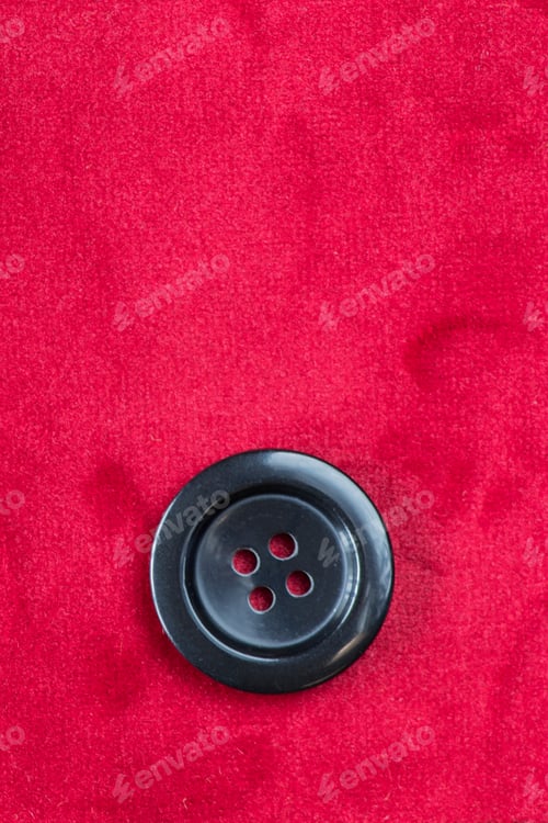 Preview: Clothes Sewing Button On A Red Pink Fabric Swatch Background