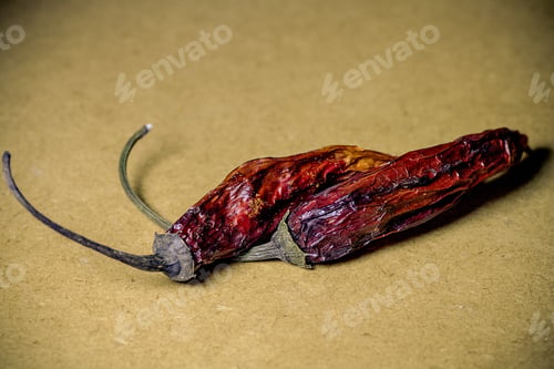 Preview: Dried Red Peppers On A Wooden Table.
