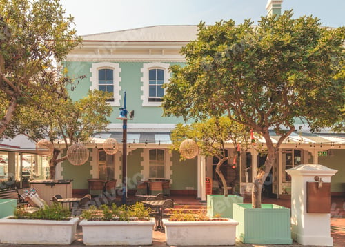 Preview: Facade Of A Beautiful House With Trees In Front