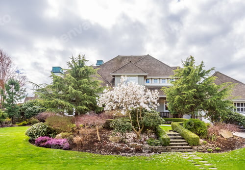 Preview: Beautiful Exterior Of Newly Built Luxury Home. Yard With Green Grass And Walkway Lead To Front