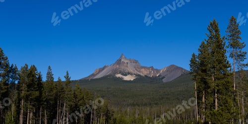 Preview: Photograph Of Mount Thielsen On A Sunny Clear Day With Vivid Blue Skies And Green Forest