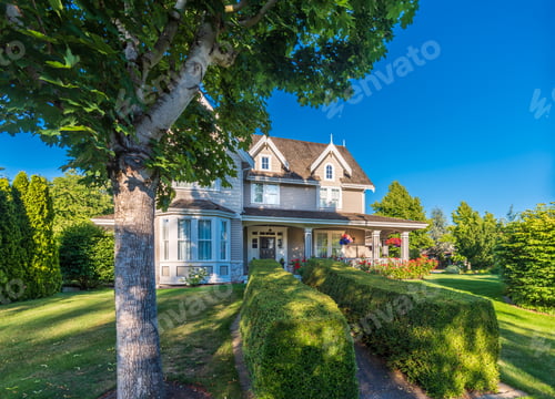 Preview: Beautiful Exterior Of Newly Built Luxury Home. Yard With Green Grass And Stones