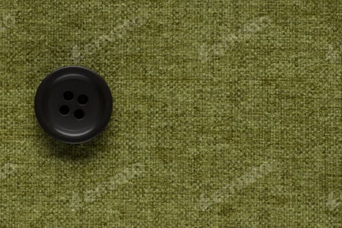 Preview: Clothes Sewing Button On A Green Fabric Swatch Background