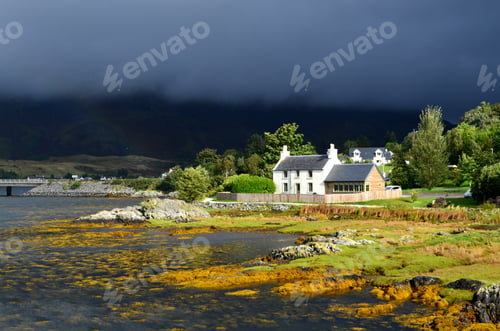 Preview: Beautiful Landscape In Scotland With A House Right On The Water