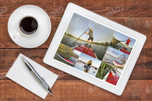 Preview: Reviewing Pictures Of Stand Up Paddling Featuring A Senior Male On A Digital Tablet With A Cup Of