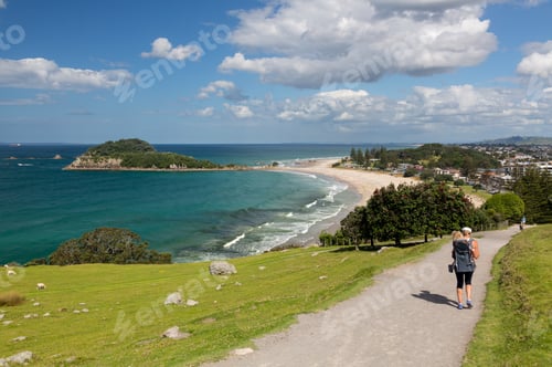 Preview: Woman With Baby In Carrier Hikes The Steep Path Around The Mount In Tauranga New Zealand
