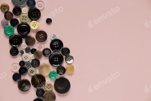 Preview: Multi Colored Clothes Sewing Buttons On Pink Background