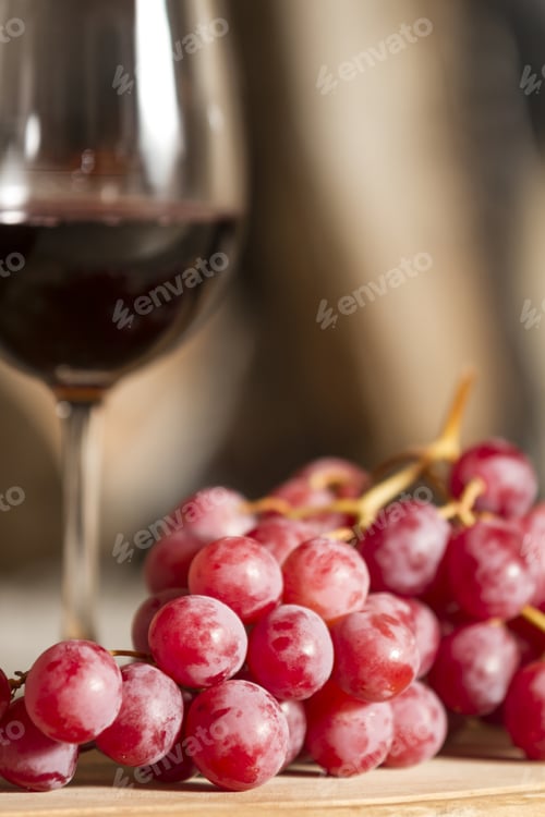 Preview: Grapes And A Cup Of Wine Over A Wooden Table.