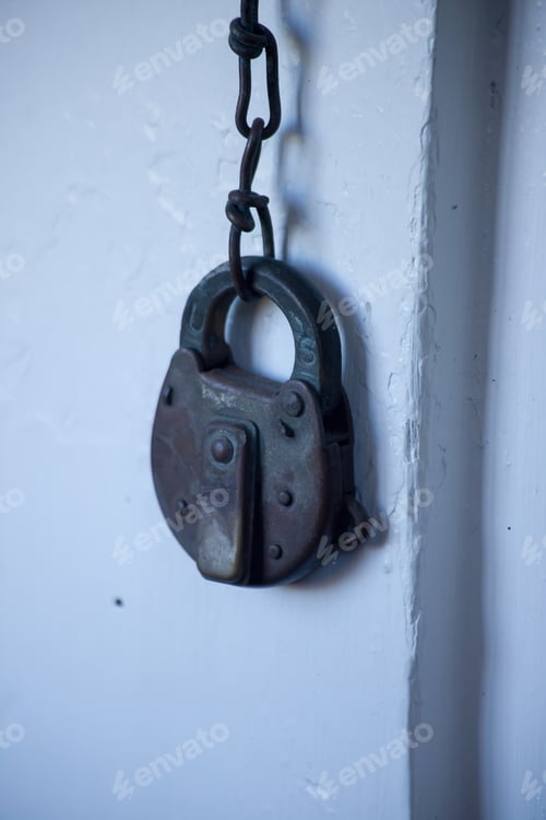 Preview: Old Key Lock On A Chain Outdoors