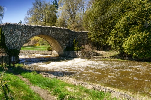 Preview: River And Arch Bridge In Rural Setting, Outdoors, Ontario, Canada.