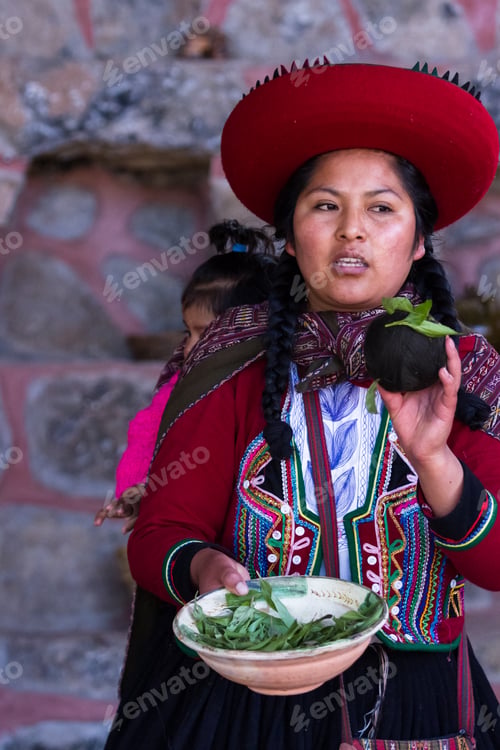 Preview: Chinchero Peru -May 18 : Native Cusquena Woman Dressed In Traditional Colorful Clothing Explaining
