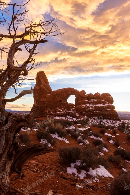 Preview: Beautiful Scene With The Sun Setting Behind Turret Arch And Amazing Color In The Clouds Above