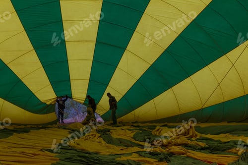 Preview: Sedona, Arizona - April 12 : Crew Members Adjusting A Hot Air Balloon While It Being Inflated