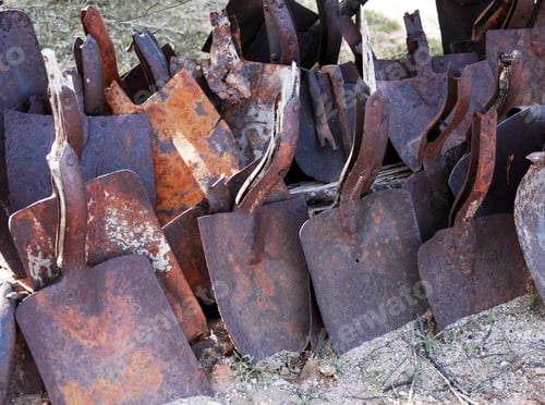 Preview: Rows Of Rusted Shovels Outside
