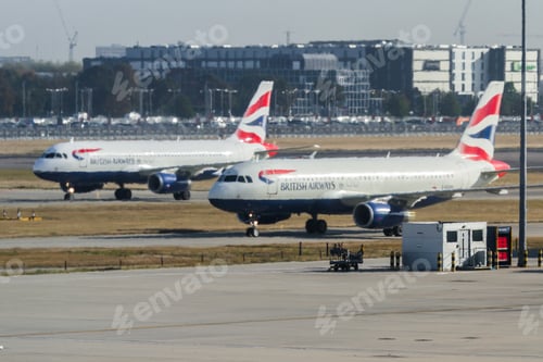 Preview: Heathrow, London Uk - September 19 2019: British Airways Planes On Taxiways Waiting For