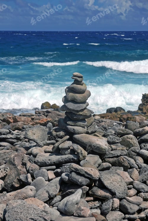 Preview: Stacked Rocks On A Rocky Beach With Surf