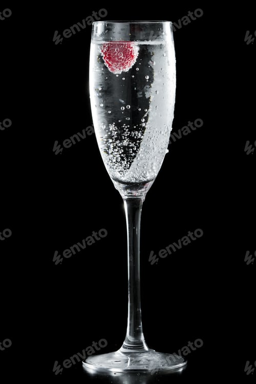 Preview: Clear Sparkling Wine In A Champagne Flute With A Red Raspberry Floating In It