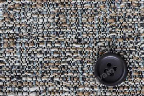 Preview: Clothes Sewing Button On A Gray Fabric Swatch Background