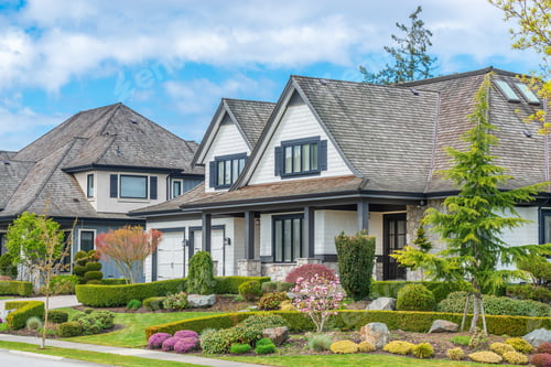 Preview: Beautiful Exterior Of Newly Built Luxury Home. Yard With Green Grass And Walkway Lead To Front
