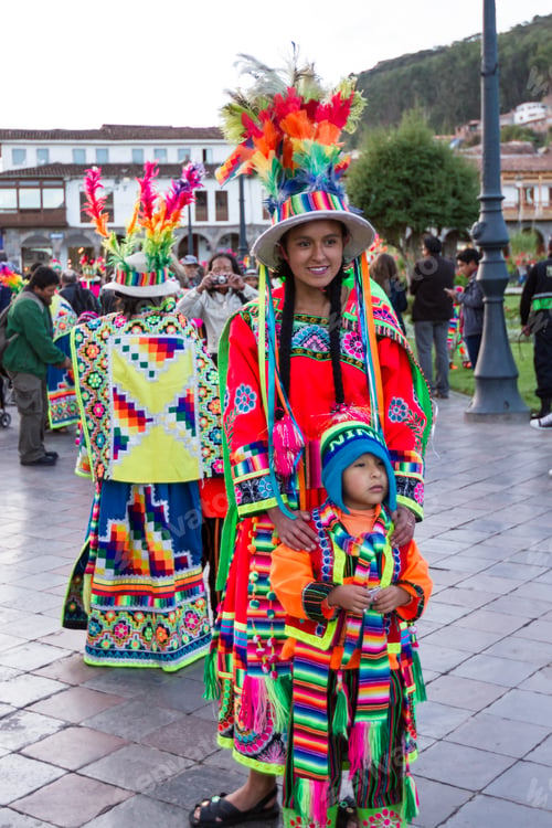 Preview: Cusco, Peru - May 13: Young Mother Posing With Her Child Dressed In Beautiful Colored Clothing