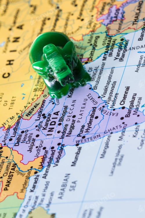 Preview: View Of A World Map With India In Focus Adn A Small Jade Elephant