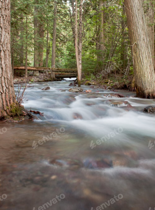 Preview: Creek In Glacier National Park With A Very Slow Shutter Speed Showing All The Colors Of The Rocks