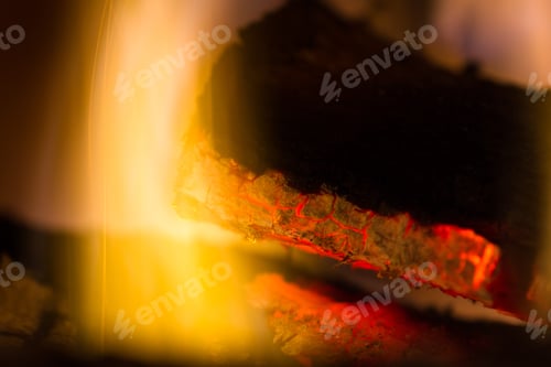 Preview: Close Up Of Glowing Red Embers And Flames On A Lot In The Fireplace