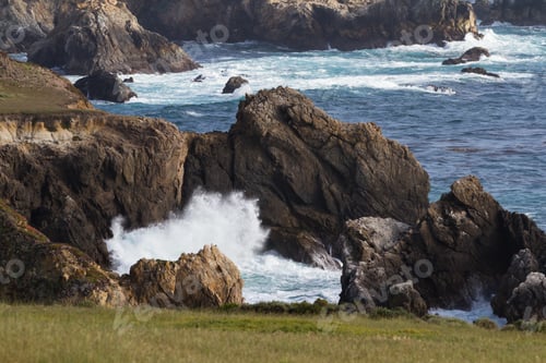 Preview: Dramatic Landscape Of The California Coast With Waves Splashing On The Cliffs And Rocks