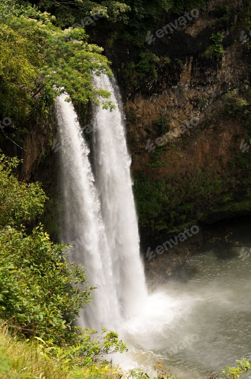 Preview: Sun Illuminates The Twin Falls Of Wailua Waterfall On Hawaiian Island Of Kauai