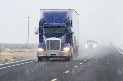 Preview: Snowy Afternoon On A Busy Highway With Traffic And Low Visibility For A Winter Caution Concept