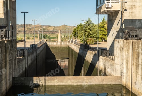 Preview: Barragem Do Pocinho Dam On The Douro River In Portugal As Cruise Boat Waits By Lock Gates