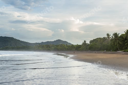 Preview: Tambor, Costa Rica - June 20: Young Surfer Walking The Beach. June 20 2016, Tambor, Costa Rica.