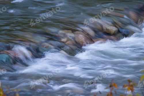 Preview: Pristine Creek Consisting On Glacier Melt Rushing Over Rocks In Glacier Montana