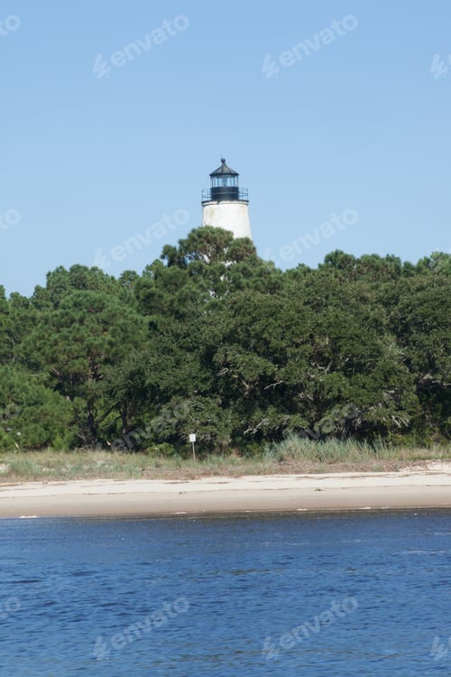 Preview: Lighthouse On The Bank With Trees Around It