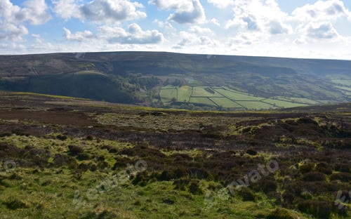 Preview: White Clouds Over Rolling Hills, Fields And Moors.
